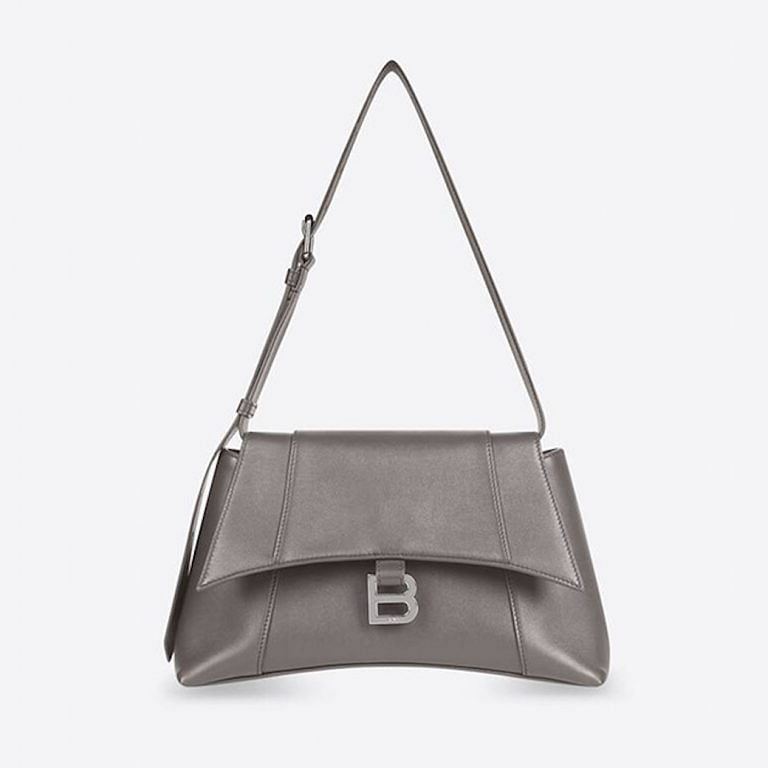 10 classic handbags with initial logo clasps we're eyeing now 